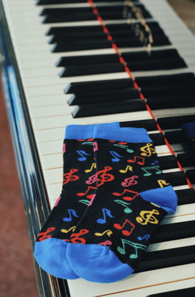 Socks with musical notes on a piano