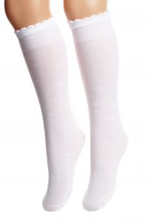 White cotton knee-high socks for children adorned with cute small heart patterns.